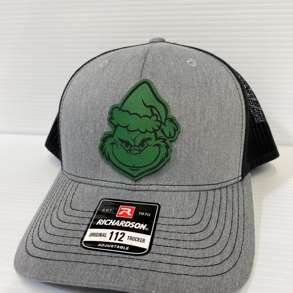Grinch Face Leather Patch Trucker Hat