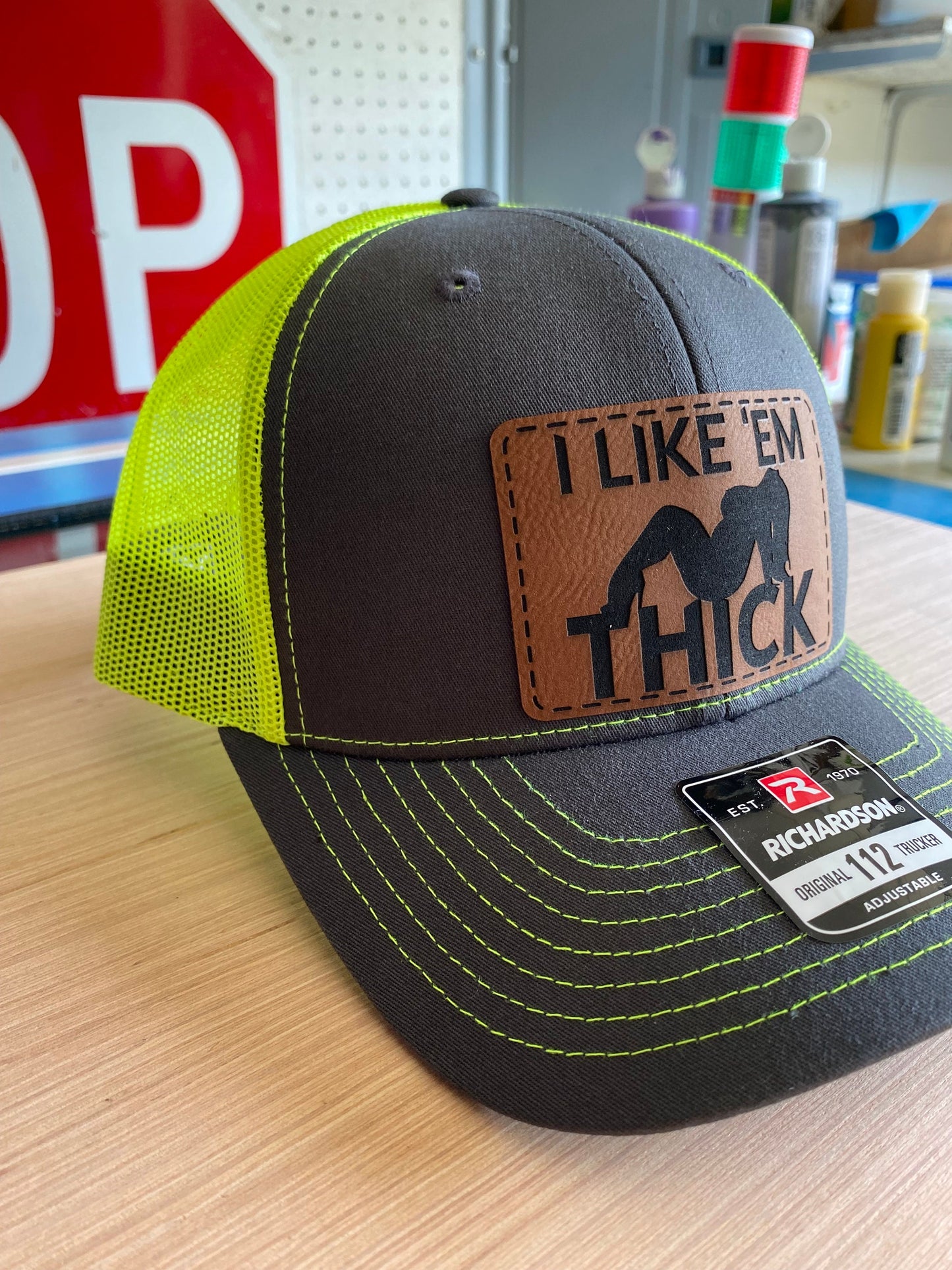 I Like 'Em Thick Leather Patch Trucker Hat