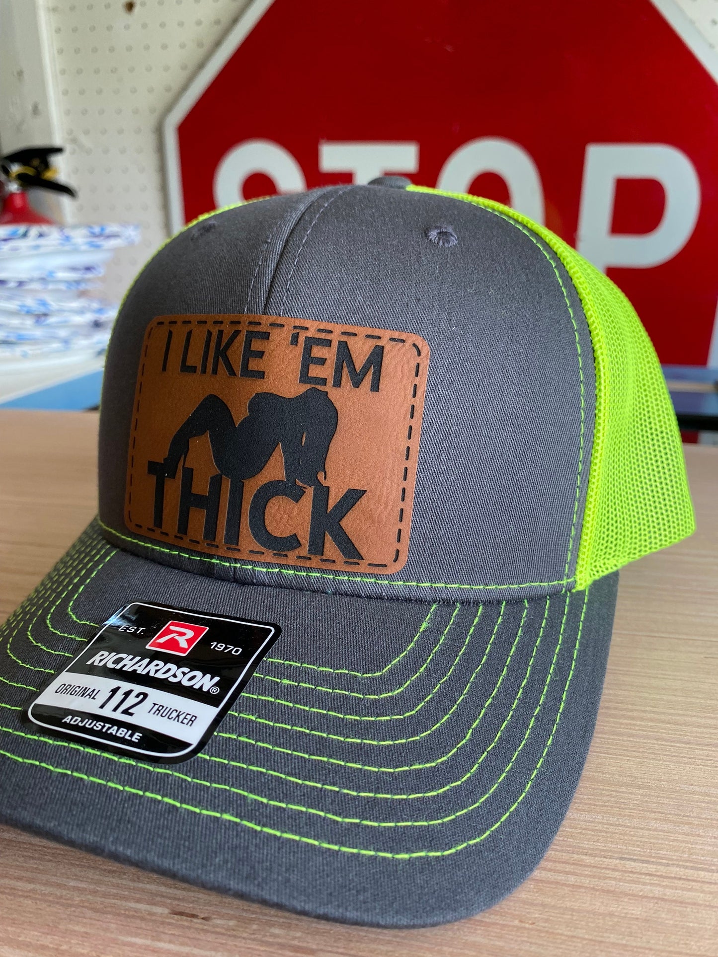 I Like 'Em Thick Leather Patch Trucker Hat
