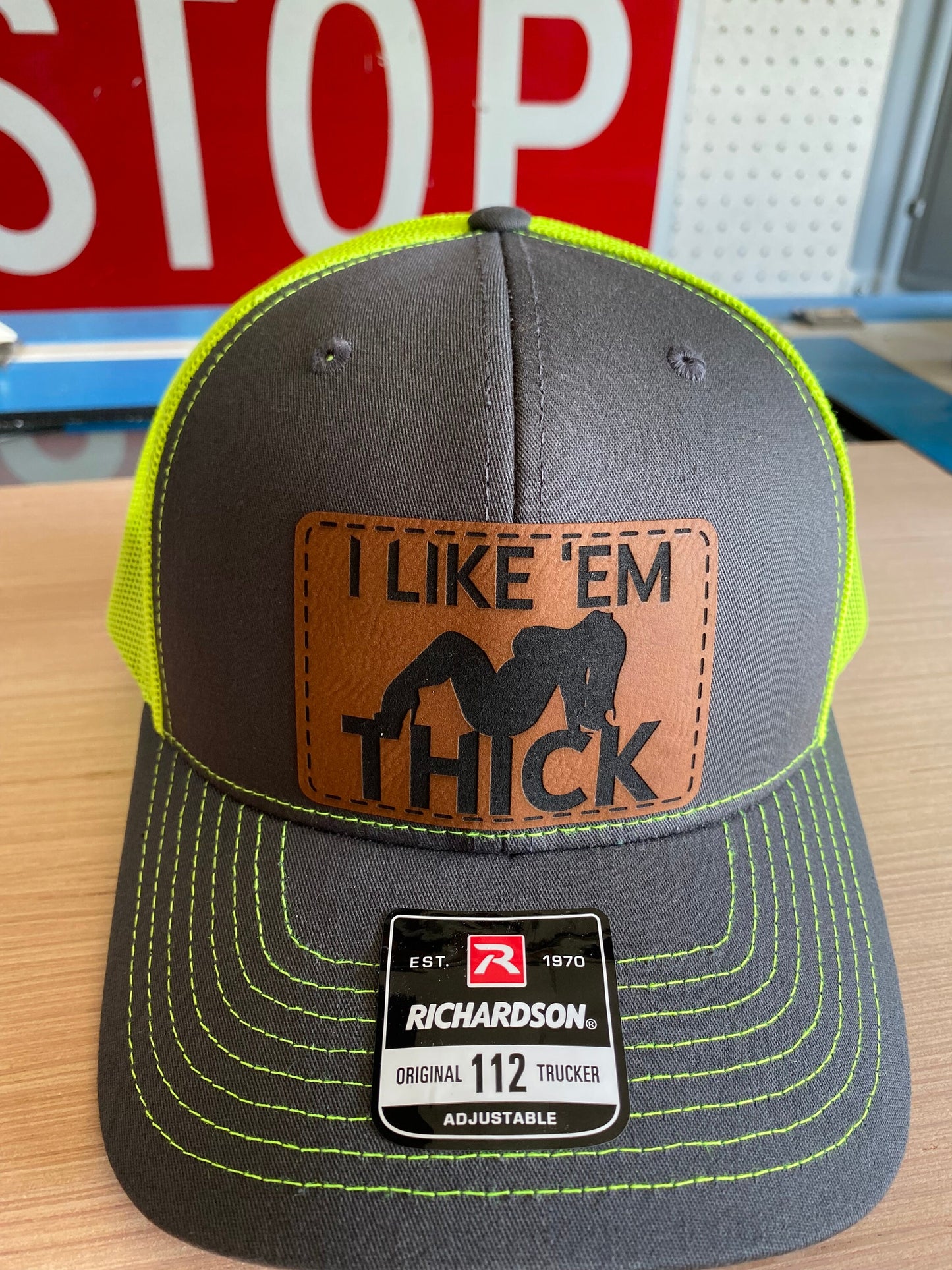 I Like 'Em Thick Leather Patch Trucker Hat