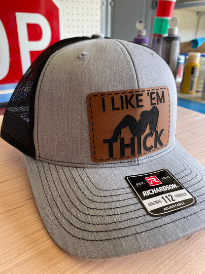 I Like 'Em Thick Leather Patch Trucker Hat