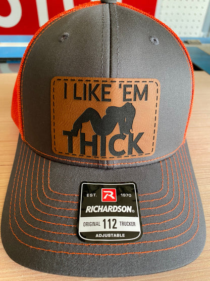 I Like 'Em Thick Leather Patch Trucker Hat