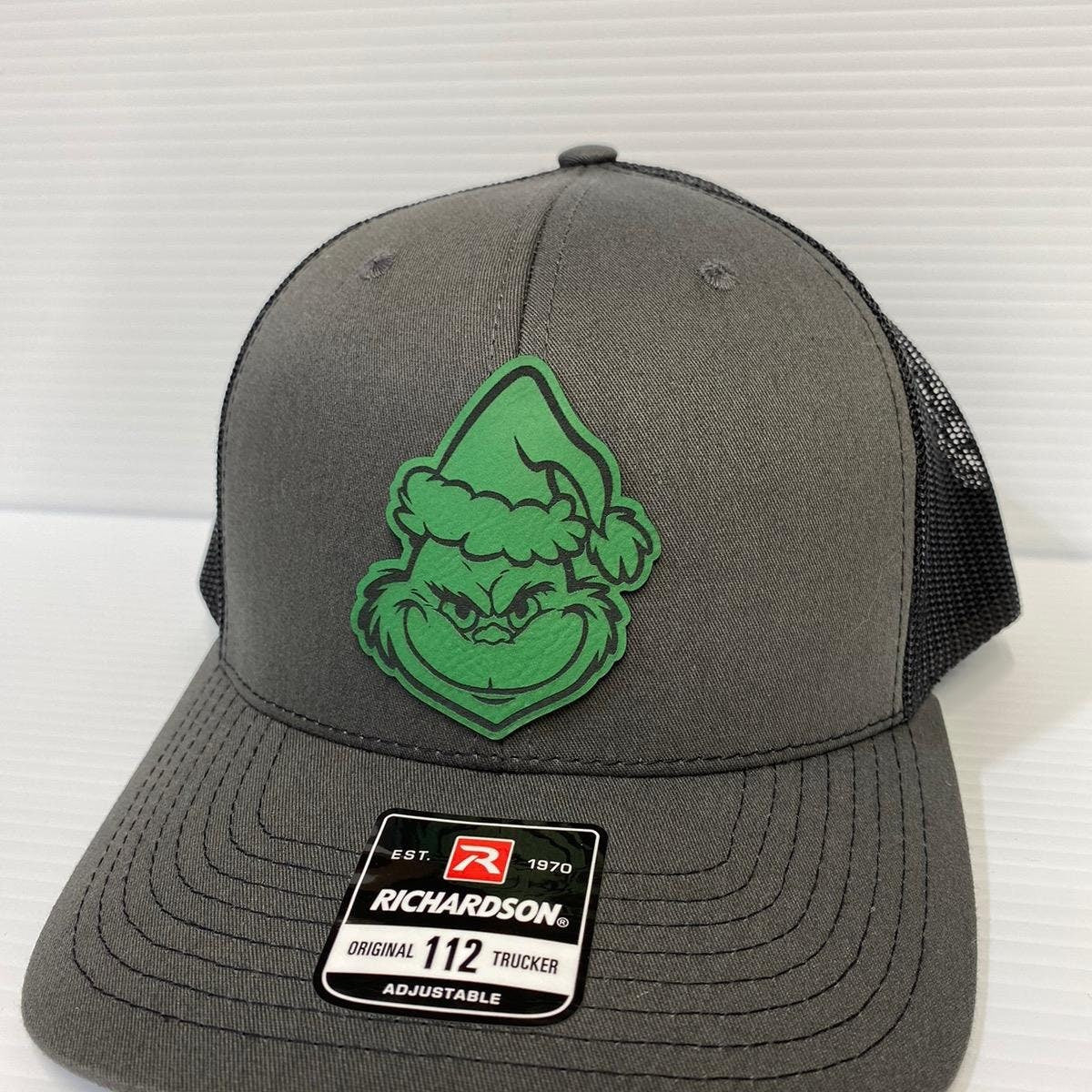 Grinch Face Leather Patch Trucker Hat