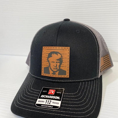 Trump 2024 Mugshot Leather Patch Trucker Hat