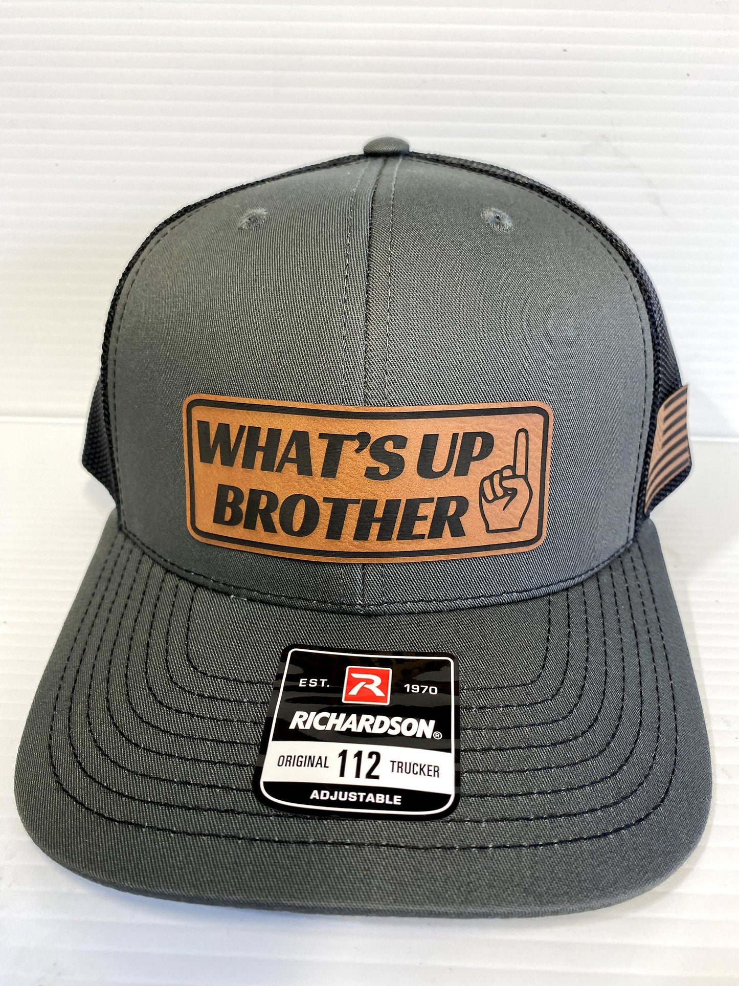 What's Up Brother Trucker Hat: Leather Patch Richardson 112